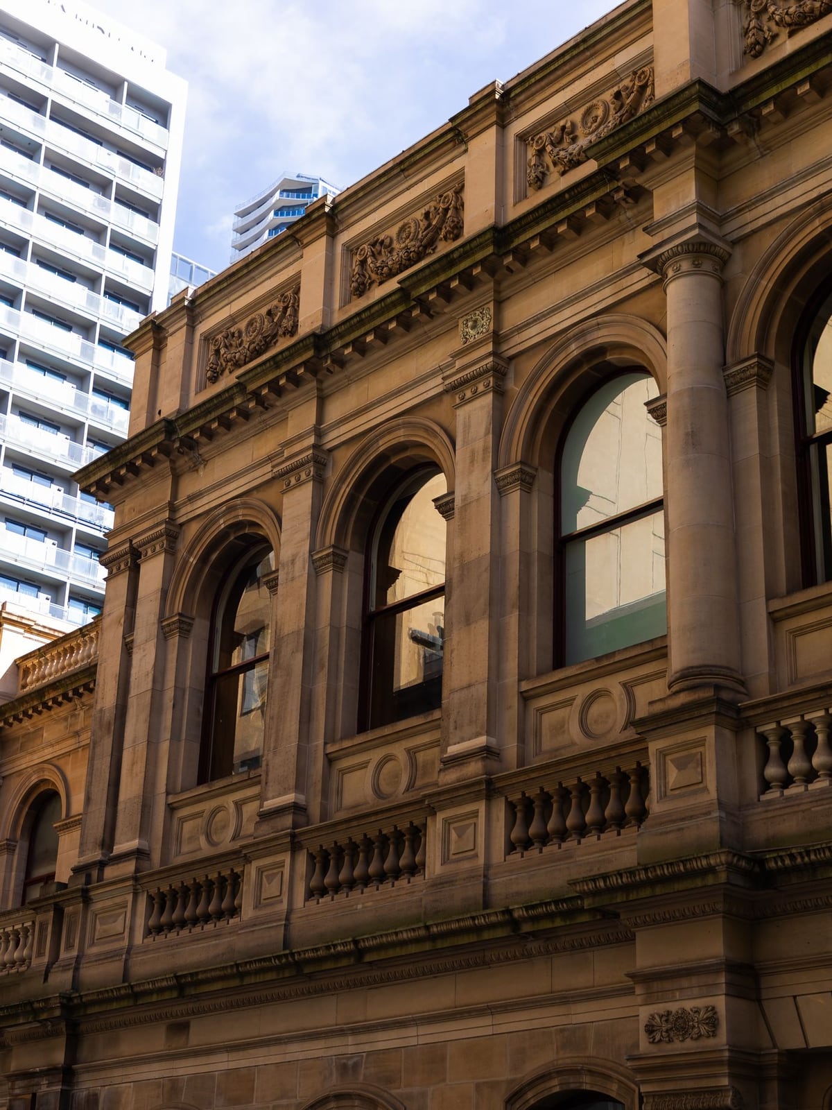 The modern building entrance in Brisbane City where the studio is located.
